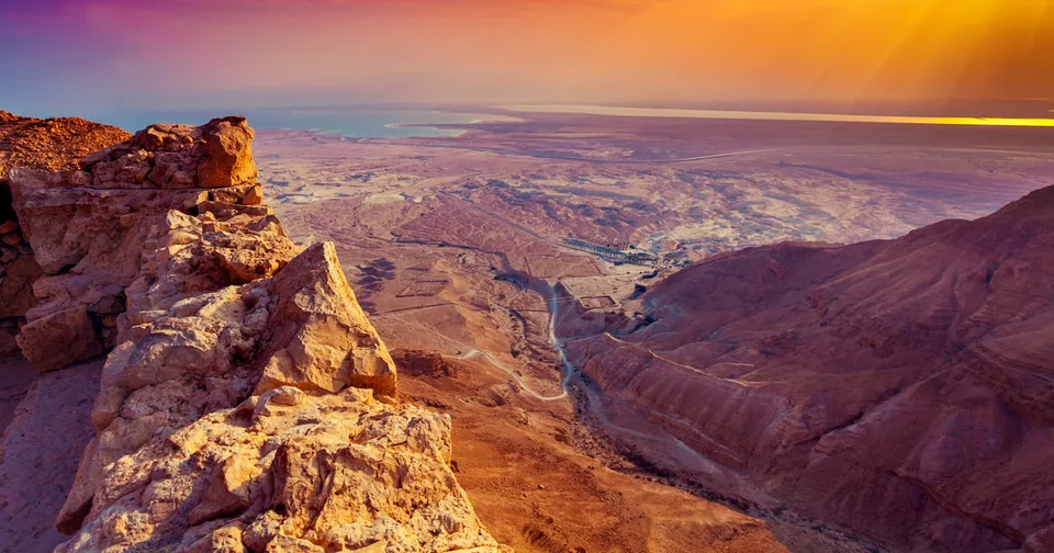 Sunrise over desert cliffs and a canyon
